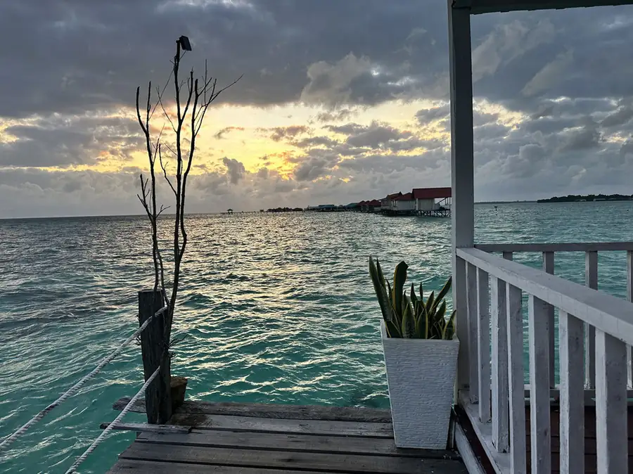 Private sun-drenched balcony with ocean views at Bihing Angan Water Chalet. Perched above the Celebes Sea.